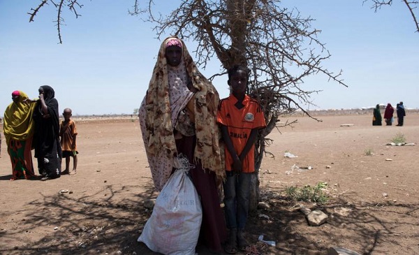 CH1659627_Leylo,_28,__photographed_with_her_four-month-old_son,_Assad,_and_her_12-year-old_son,_Yuusuf,_in_a_camp_in_Baidoa_in_the_South_West_State_of_Somalia
